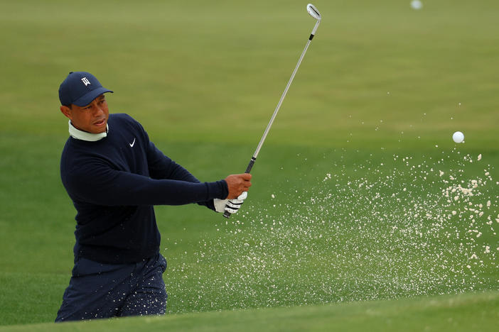Tiger Woods warms up during a practice round prior to the Masters at Augusta National Golf Club on Tuesday in Augusta, Ga.