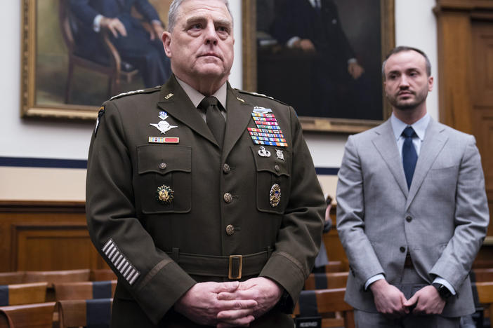 Chairman of the Joint Chiefs of Staff Gen. Mark Milley, left, arrives for a House Armed Services Committee hearing on the fiscal year 2023 defense budget on April 5, 2022, in Washington.