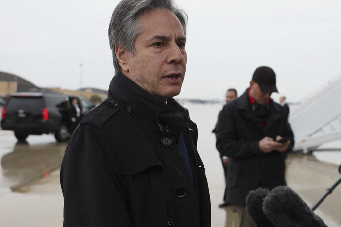 U.S. Secretary of State Antony Blinken speaks to members of the media, before departing for Brussels from Joint Base Andrews, in Maryland, on Tuesday.