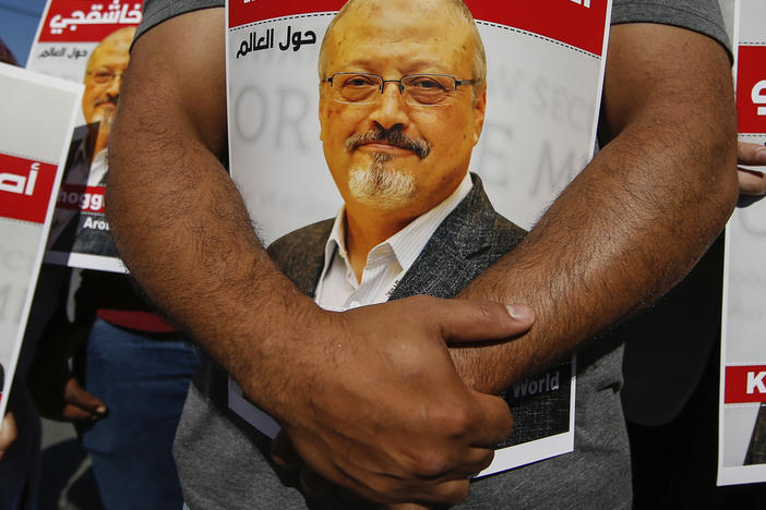 People hold posters of slain Saudi journalist Jamal Khashoggi near the Saudi Arabia consulate in Istanbul, Oct. 2, 2020, marking the two-year anniversary of his death.