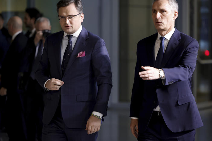 Ukraine's Foreign Minister Dmytro Kuleba, left, walks with NATO Secretary General Jens Stoltenberg as they arrive for a meeting of NATO foreign ministers at NATO headquarters in Brussels on Thursday.