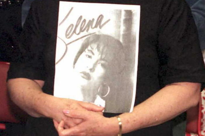 Detail of a photo of Selena fan Olivia Leak, shown holding a poster of the pop star at a memorial held in Los Angeles on April 2, 1995, two days after Selena's murder in Corpus Christi, Texas.