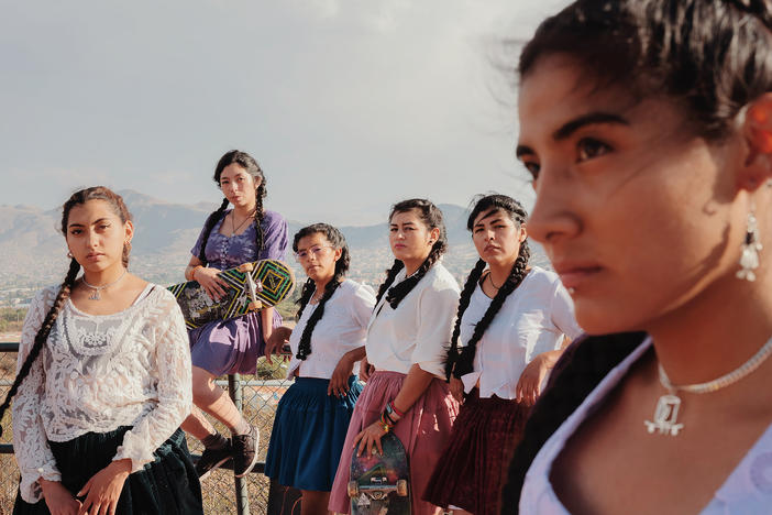 Members of the all-female skate crew ImillaSkate in Cochabamba, Bolivia. The athletes wear <em>polleras</em>,<em> </em>skirts traditionally worn by Bolivia's Indigenous Aymara and Quechua women, when they skate at tournaments. "Many girls who see us skating feel proud to see us dressed [this way]," says skater Fabiola Gonzales. "Even our own families feel proud we're showing our traditions."