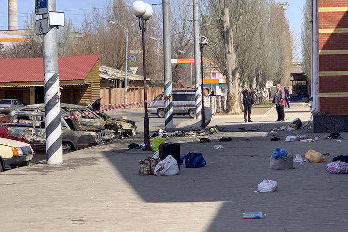 Personal belongings of victims and burned vehicles are seen after an alleged rocket attack Friday at the railway station in the eastern city of Kramatorsk, Ukraine.
