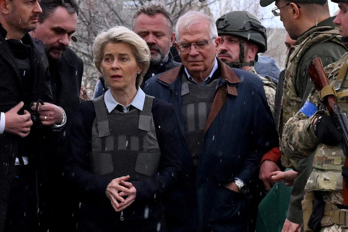 Slovakian Prime Minister Eduard Heger (left), European Commission President Ursula von der Leyen and European Union High Representative for Foreign Affairs and Security Policy Josep Borrell visit a mass grave in the town of Bucha on Friday.
