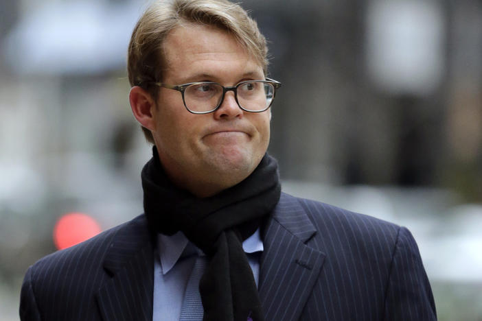 Mark Riddell arrives at federal court in Boston on April 12, 2019. The former Florida prep school administrator took college entrance exams for students in exchange for cash to help wealthy parents get their kids into elite universities.