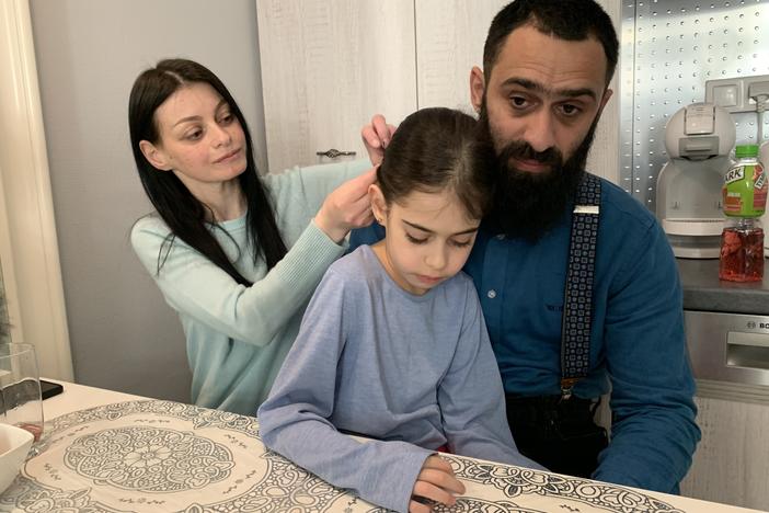 Olena Kopchak, her husband, Albert Kodua, and their eight-year-old daughter, Yana, are staying in a small 250-square-foot apartment in Warsaw, Poland. They hope to make it to the United States.