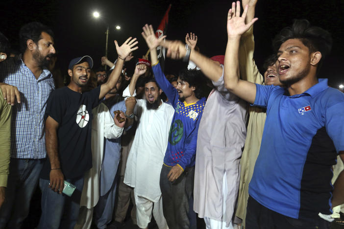 Supporters of an opposition party celebrate the success of a no-confidence vote against Prime Minister Imran Khan, in Karachi, Pakistan on Sunday.