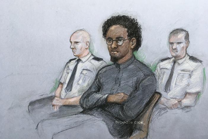 This court artist sketch by Elizabeth Cook shows Ali Harbi Ali in the dock at the Old Bailey accused of stabbing to death David Amess, a Conservative member of Parliament, in London on March 21.