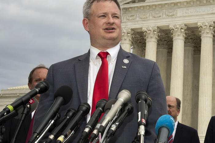 South Dakota Attorney General Jason Ravnsborg speaks to reporters in front of the U.S. Supreme Court in Washington on Sept. 9, 2019.