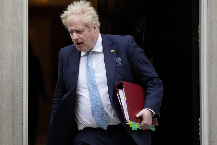 Prime Minister Boris Johnson leaves 10 Downing Street to attend the weekly Prime Ministers' Questions session in parliament in London, on March 30. Johnson's office says he will be issued a fine for breaching COVID-19 regulations following allegations of lockdown parties at government offices.