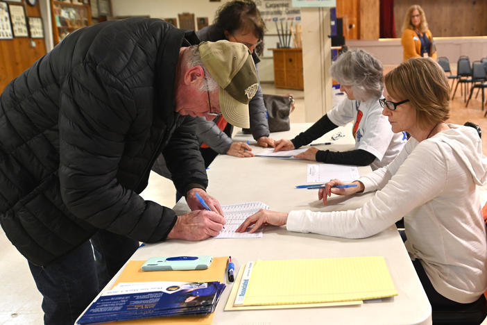 Caucusgoers are seen here in Carpenter, Iowa, on Feb. 3, 2020. The Democratic National Convention approved a resolution Wednesday that revamps its presidential nominating process, which means Iowa could lose its "first in the nation" status.