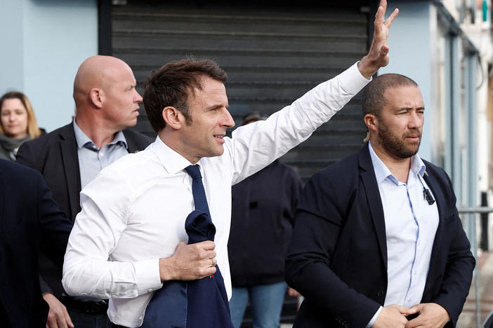 France's President and French liberal party La Republique en Marche (LREM) candidate to his succession Emmanuel Macron waves to supporters during a one-day campaign visit in Hauts-de-France region, in Carvin, northern France, on Monday.