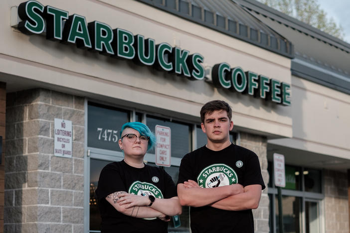 Starbucks shift supervisor Gailyn Berg and barista Tim Swicord outside of their store in Springfield, Virginia.