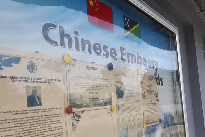 A display case of photos is seen outside the Chinese Embassy in Honiara, Solomon Islands, April 2, 2022.