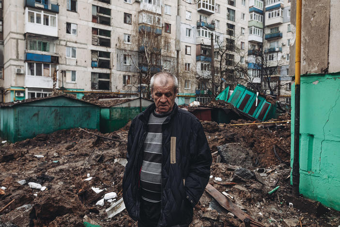 An Ukrainian man stands among the ruins at a residential area damaged by shelling in Lysychansk, Ukraine, on Wednesday.