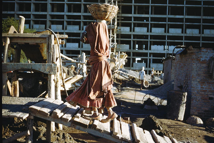 Women were an integral part of the construction effort. Among their jobs: Carrying cement for a building project in Chandigarh, India in 1956.