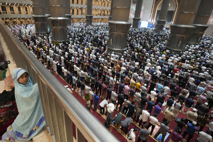 A little girl looks on during an evening prayer on the eve of the holy fasting month of Ramadan at Istiqlal Mosque in Jakarta, Indonesia.