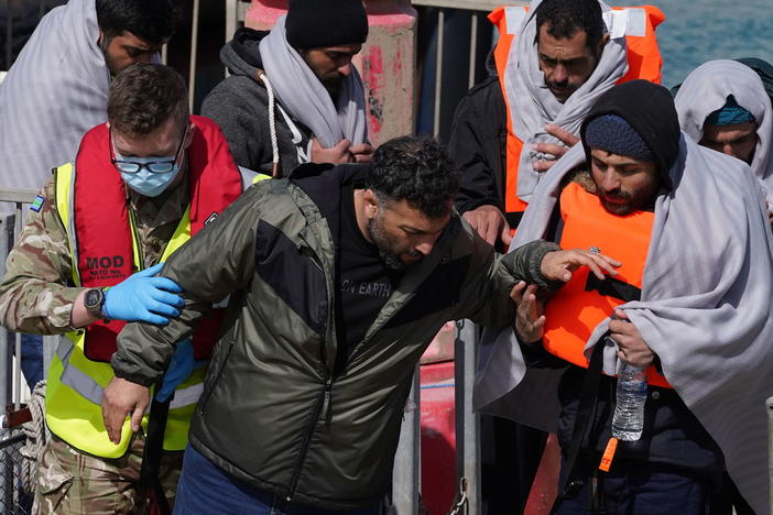 A group of people thought to be migrants are brought in to Dover, Kent, by the RNLI, following a small boat incident in the Channel, Thursday April 14, 2022.