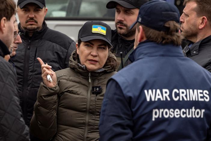 Ukraine's Prosecutor General Iryna Venediktova visits a mass grave in Bucha, on the outskirts of Kyiv, on April 13, 2022. The International Criminal Court's chief prosecutor to Bucha visited as the front in Russia's invasion shifted eastward and new allegations of crimes inflicted on locals emerged.