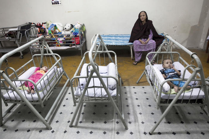 Bilquis Edhi watched over abandoned children in cradles at the Edhi orphanage in Karachi in 2010. Over the years, thousands of children have been left in the network of cradles outside Edhi centers she set up across Pakistan.