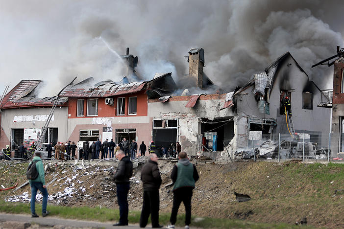 Firefighters battle a blaze after a civilian building was hit by a Russian missile on Monday in Lviv, Ukraine. Ukrainian officials said at least seven people were killed and more were wounded in missile strikes in different areas of the city.