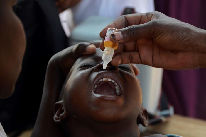 A child receives a polio vaccine in Kampala, Uganda, on Jan. 14, 2022.