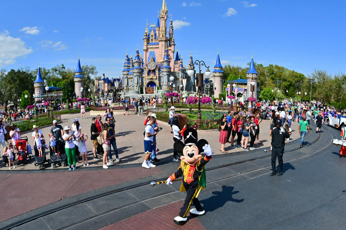 Mickey Mouse waves to fans during a parade at Walt Disney World Resort on March 03, 2022 in Lake Buena Vista, Florida.