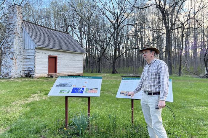 Matt Reeves, a former employee of Montpelier who was fired this week, is pictured outside of the historic Gilmore cabin at Montpelier.