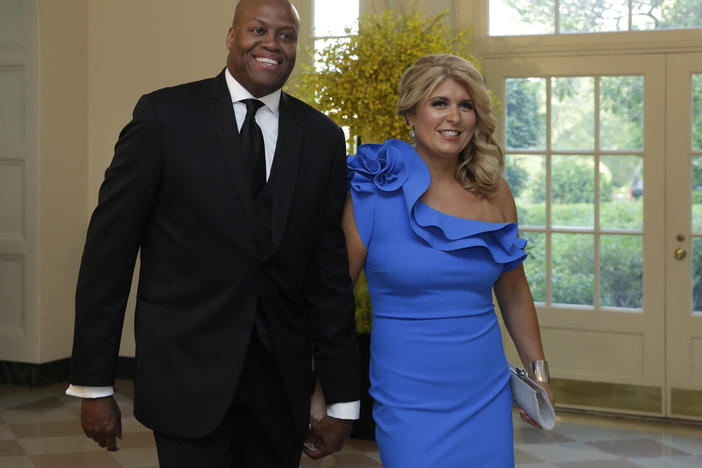 Craig Robinson and his wife, Kelly Robinson, have filed a lawsuit against a Milwaukee-area private school over issues of inclusiveness and alleged racism. Here, they arrive at a state dinner at the White House in 2016.
