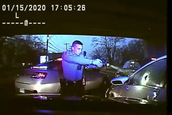 This Jan. 15, 2020, still image from dashboard camera video released by the Connecticut State Police shows Trooper Brian North after discharging his weapon and fatally shooting Mubarak Soulemane following a high-speed chase.