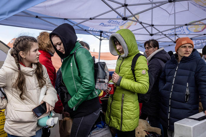 Refugees from Ukraine wait for a bus in Medyka, southeastern Poland, on April 8 after having crossed the Ukraine-Poland border.