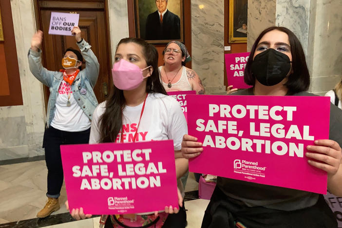 Abortion-rights supporters chant their objections at the Kentucky Capitol in Frankfort on April 13, as state lawmakers debate overriding the governor's veto of an abortion measure.