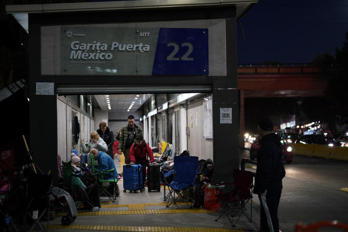 Ukrainian refugees wait in a bus stop near the Mexico border in early April. The arrival of hundreds of Ukrainians at the border since the war began has added more pressure on the Biden administration to lift Title 42.