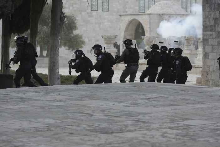 Israeli police clash with Palestinian protesters at the Al Aqsa Mosque compound in Jerusalem's Old City, Friday, April 22, 2022.