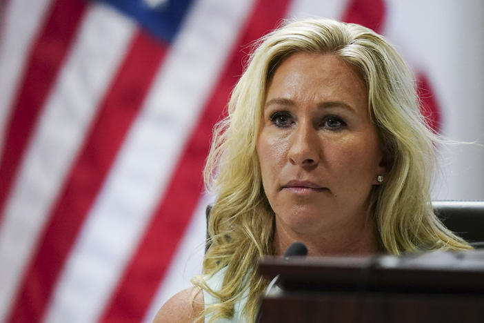 Georgia Republican U.S. Rep. Marjorie Taylor Greene testifies Friday in an Atlanta court for a hearing in a challenge filed by voters who say she shouldn't be allowed to seek reelection because of her role prior to the attack on the U.S. Capitol.