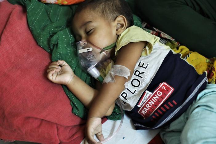 A baby who is suffering from pneumonia receives treatment  at a hospital in Dhaka, Bangladesh on January 13, 2022. A new study points to concerns about childhood deaths after a hospitalization for such diseases as pneumonia, diarrhea and malaria.