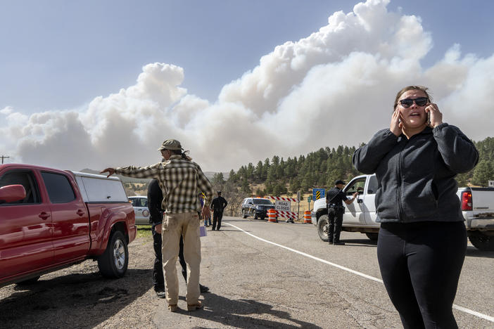 Kylee Moberg tries to get through a road block on N.M. 94 to get to her friend and horses on Friday. Destructive Southwest fires have burned dozens of homes in northern Arizona and put numerous small villages in New Mexico in the path of danger.