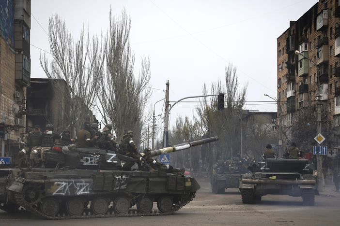 Russian military vehicles move in an area controlled by Russian-backed separatist forces in Mariupol, Ukraine on Saturday.