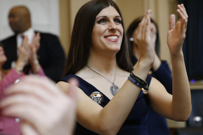 Delegate Danica Roem applauds visitors during opening ceremonies at the start of the 2019 session of the Virginia General Assembly in Richmond. The Virginia lawmaker, the first openly transgender U.S. state legislator, has written a new memoir in which she embraces the idea of using what was written about her to empower her to tell her story.