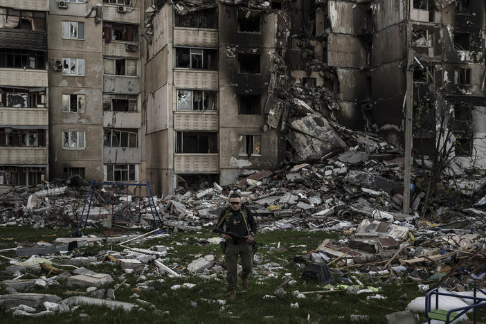 <strong>April 25:</strong> A Ukrainian serviceman walks amid the rubble of a building heavily damaged by multiple Russian bombardments near a frontline in Kharkiv, Ukraine.