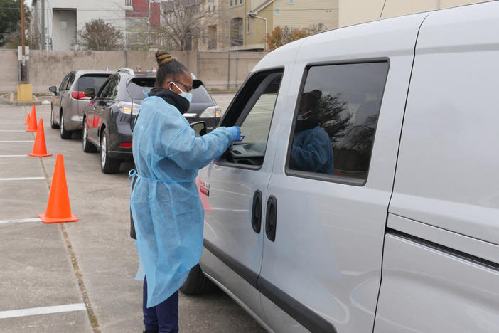 People arrive at a COVID-19 testing station in Houston, Texas, on Jan. 7. Texans were rushing to get tested as the state experienced an unprecedented spike in infections from the omicron variant.