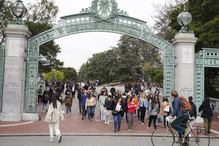 Students make their way through the Sather Gate near Sproul Plaza on the University of California, Berkeley, campus on March 29 in Berkeley, Calif.