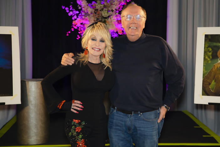Dolly Parton and James Patterson pose for a picture in August 2021. Their new novel, <em>Run, Rose, Run</em>, is about an aspiring country singer in Nashville.