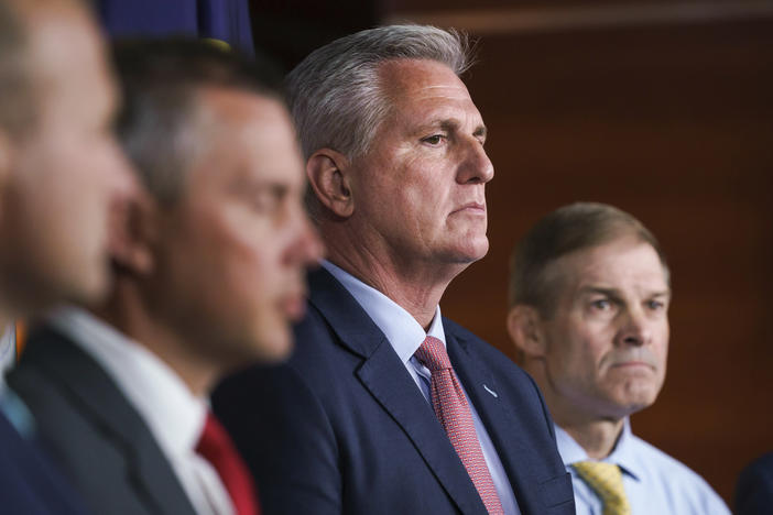 House Minority Leader Kevin McCarthy, R-Calif., center, joined at right by Rep. Jim Jordan, R-Ohio, pause during a news conference on July 21, 2021.