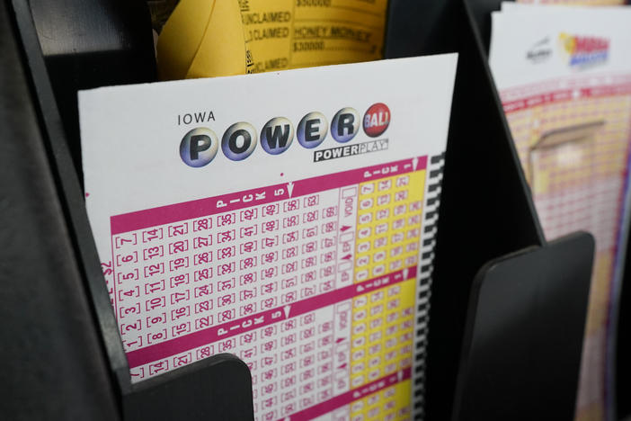 Blank forms for the Powerball lottery sit in a bin at a grocery store, in Des Moines, Iowa, on Jan. 12, 2021.