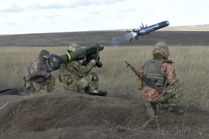 In this image taken from footage provided by the Ukrainian Defense Ministry Press Service, Ukrainian soldiers use a launcher with U.S. Javelin missiles during military exercises in the eastern Donetsk region of Ukraine, on Jan. 12. The U.S. and NATO allies have been ramping up military aid to help Ukraine fend off Russian forces.