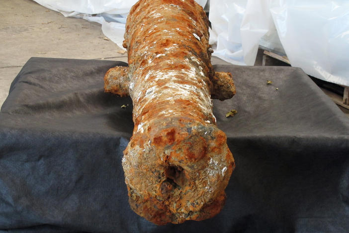 A cannon encrusted in rust and mud sits inside a warehouse operated by the Army Corps of Engineers in Savannah, Ga., on Thursday. It's one of 19 cannons discovered in the Savannah River since last year that experts believe date to the American Revolution.