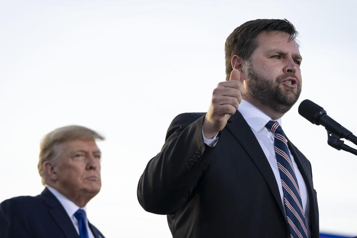 Former President Trump listens as J.D. Vance, a Republican candidate for U.S. Senate in Ohio, speaks during a rally hosted by Trump on April 23, 2022, in Delaware, Ohio. Trump had announced his endorsement of Vance in the Republican primary the week before.