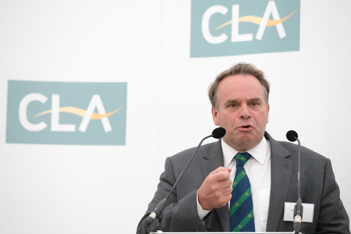 Conservative member of Parliament Neil Parish speaks at a business breakfast on June 1, 2016. He says he will resign after admitting that he watched porn in the House of Commons.